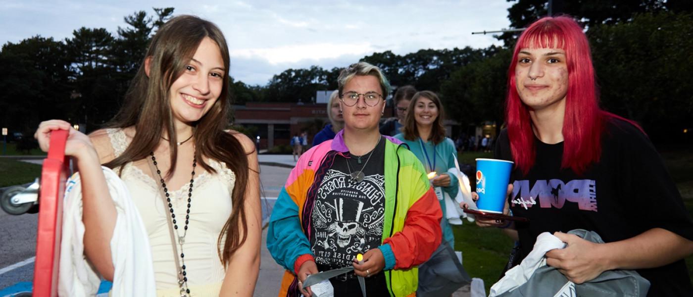 Three students stand together on First Night